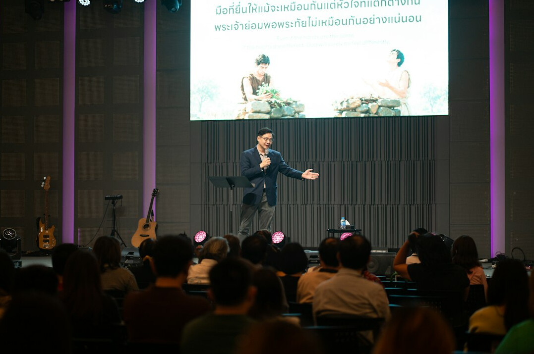 person giving presentation on stage