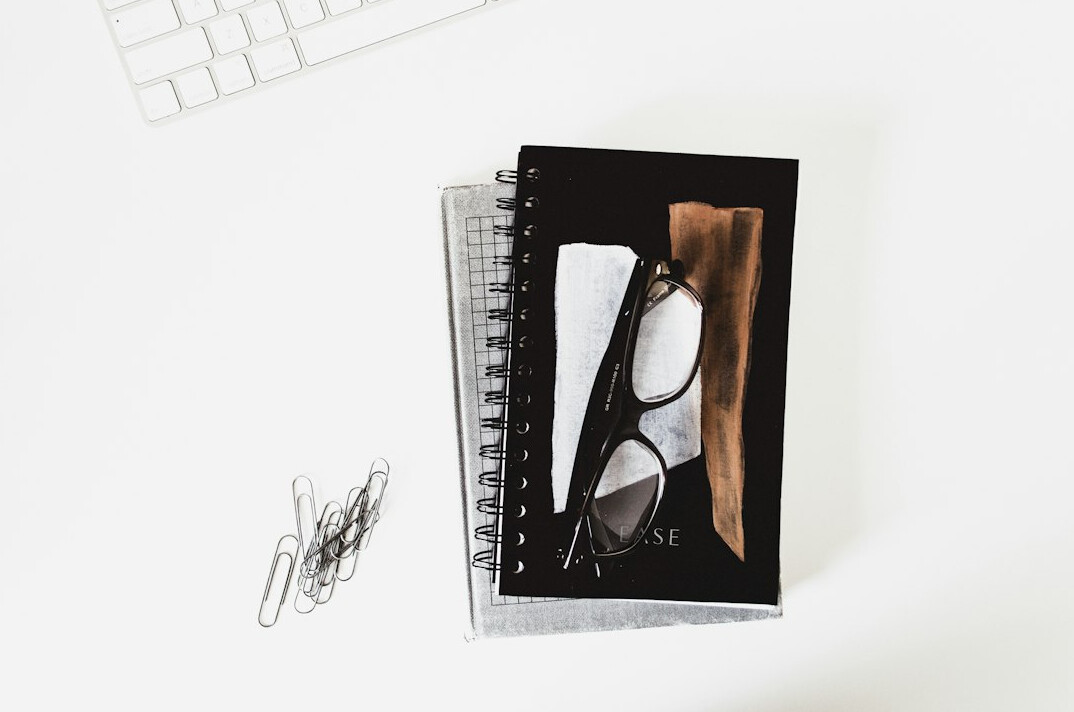 notes and laptop on desk